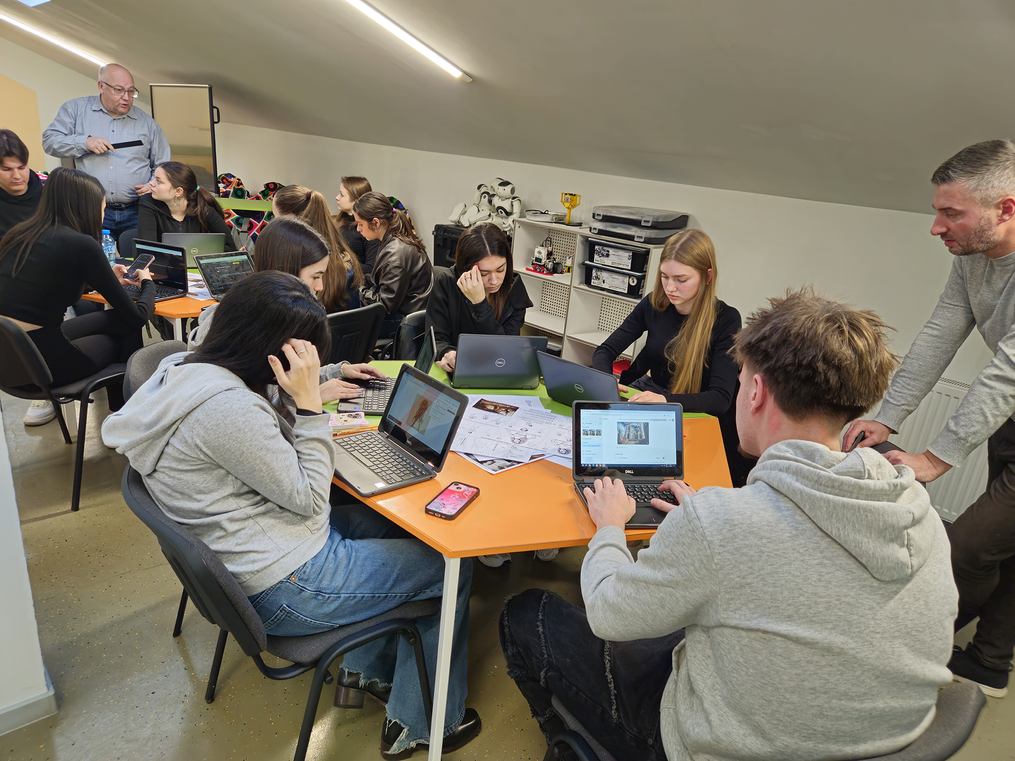 Students focused on screens showing character designs and AI-generated sketches