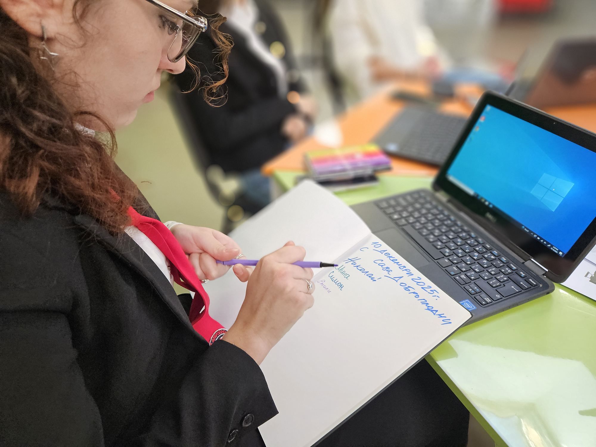 Student taking notes during the workshop with laptop